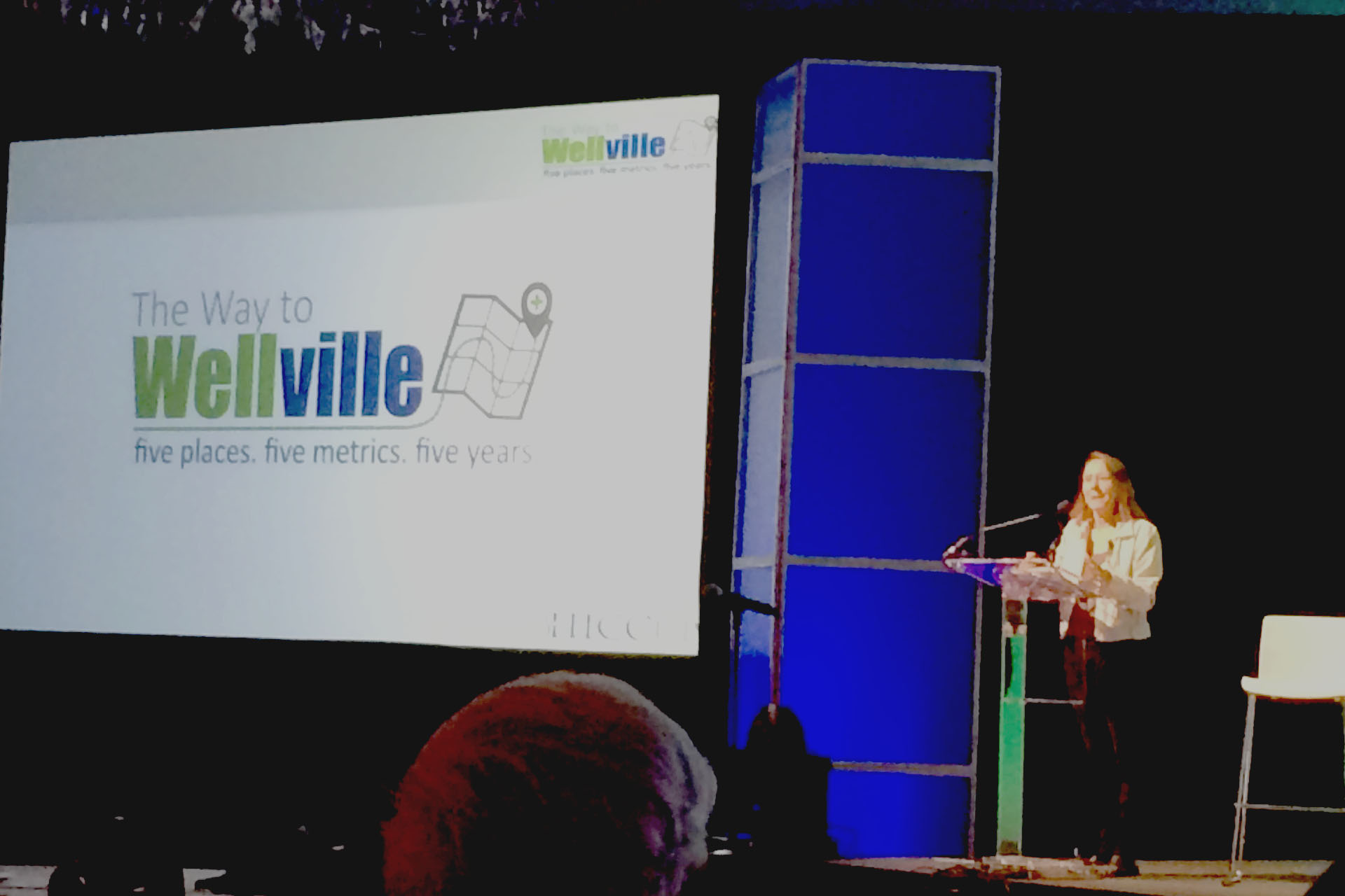 Esther introducing Wellville during the first-ever Wellville Gathering.