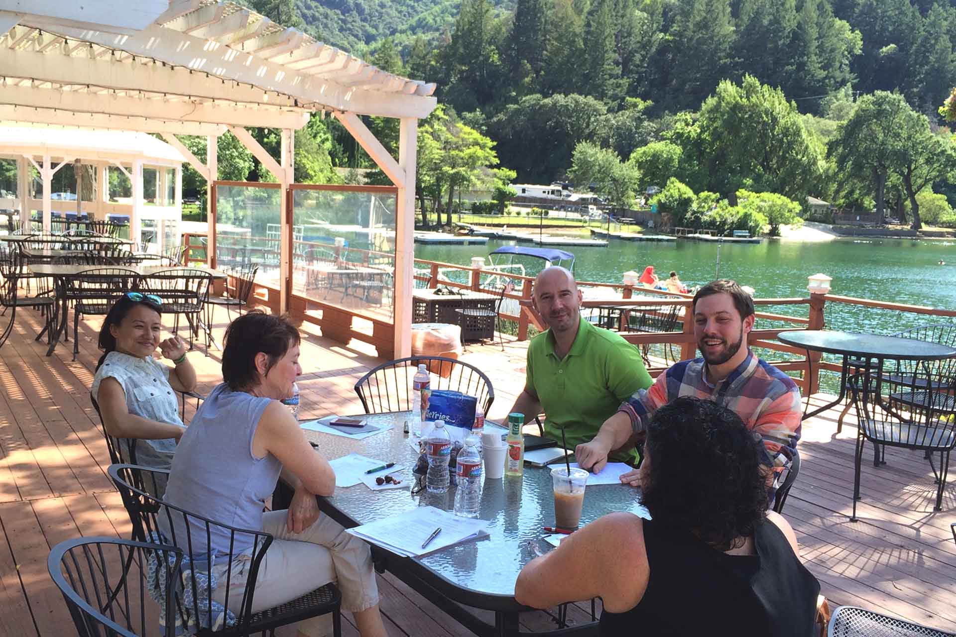 Collaborating during lunch, overlooking Blue Lake.